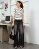 Quần jean lai tua rua túi thêu chữ "Junoclub"